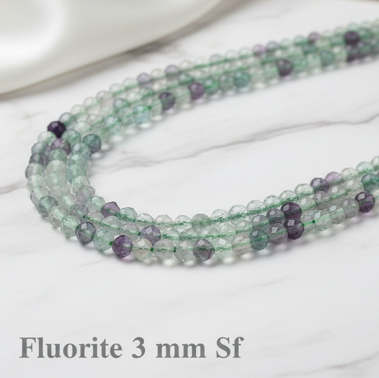 Fluorite - faceted beads 2 - 3 - 4 mm. - Strand 39 cm.