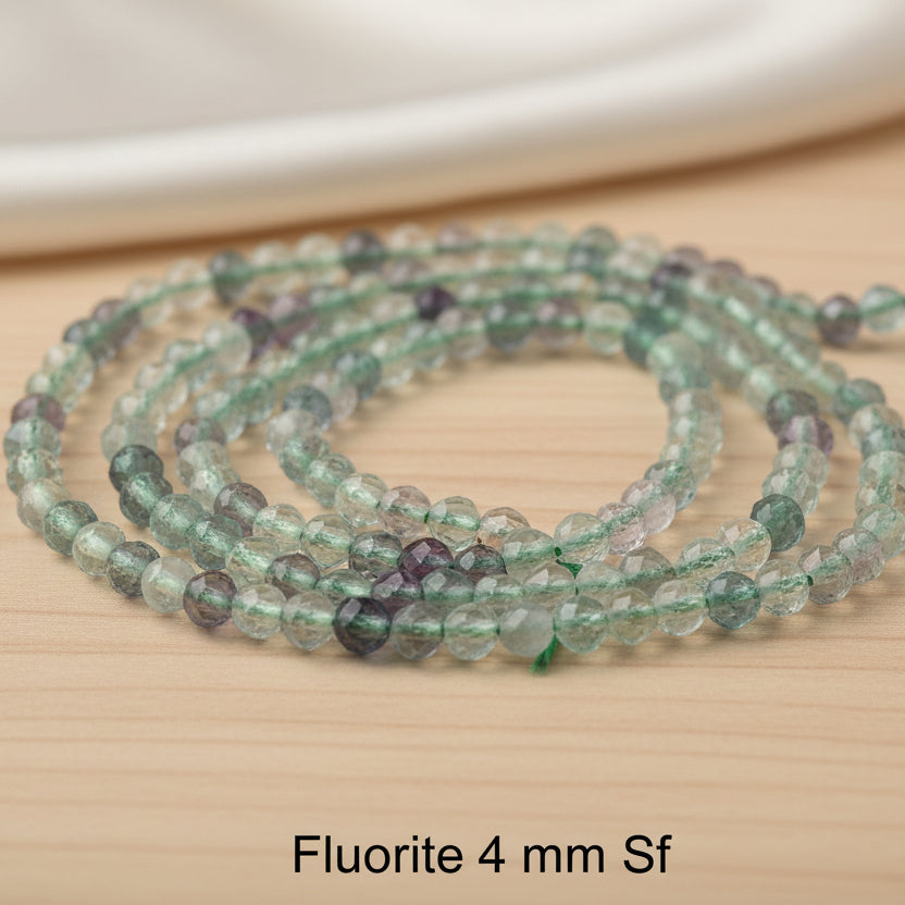 Fluorite - faceted beads 2 - 3 - 4 mm. - Strand 39 cm.